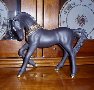 black horse with gold decoration by Cybis